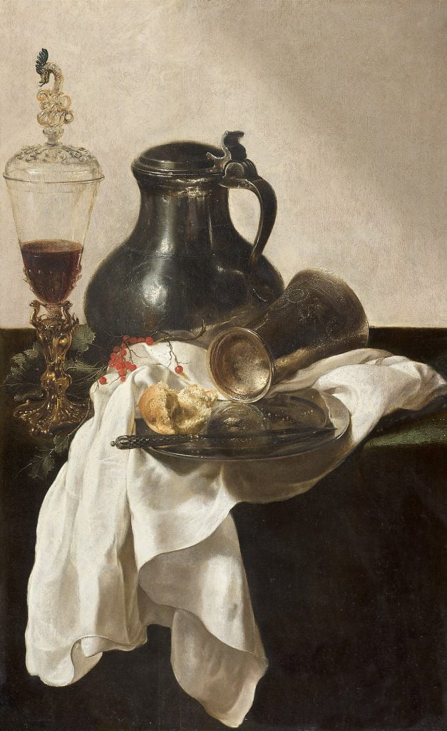 Still life with a Façon de Venice glass in a Bekerschroef, a pewter jug, a silver cup and plate with bread roll and knife, on a table with a partly draped white cloth, Jan Jansz. den UYL THE ELDER